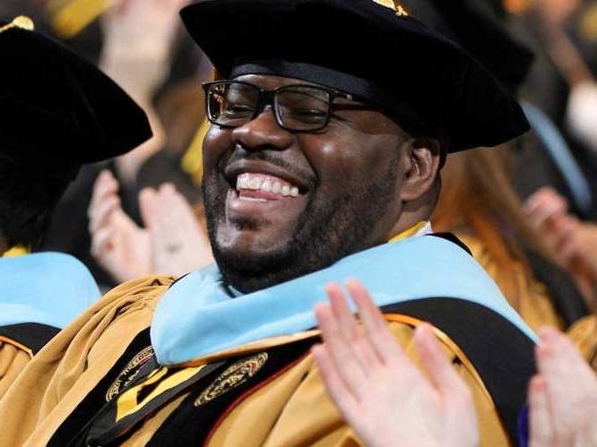 Student smiling at graduation